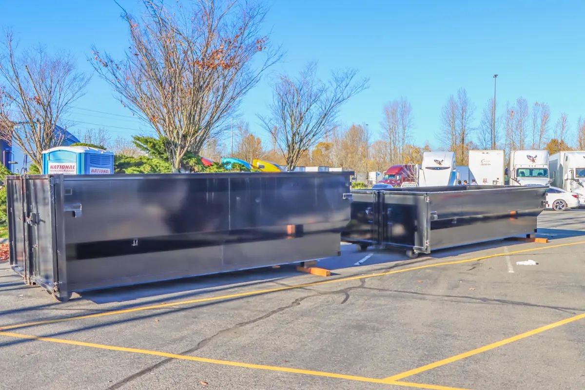 Professional dumpster rental service with roll-off container on residential driveway in Evergreen Park